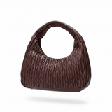Brown textured handbag on a white background