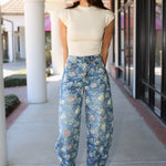 Floral denim barrel jeans and cream ribbed mock neck top