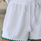 Woman wearing white Coasline Shorts and Miles Top by Z Supply