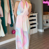 Woman wearing a pastel midi dress in a clothing store.