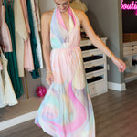 Woman wearing a colorful dress in a clothing store.