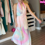 Woman wearing a colorful dress in a clothing store.