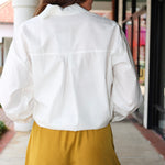 Steve Madden Daisee mustard yellow shorts with lace trim worn by a person.