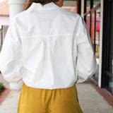 Steve Madden Daisee mustard yellow shorts with lace trim worn by a person.