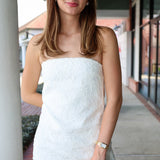 Woman wearing a white strapless dress standing outdoors. Elliatt Edelie Dress