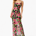 Woman wearing a Lyra Dress by Elliatt floral dress on a white background