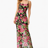 Woman wearing a Lyra Dress by Elliatt floral dress on a white background