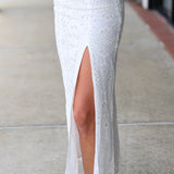 Woman in a white eyelet Emrie Top and matching Emrie skirt.  