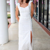 Woman in a white eyelet Emrie Top and matching Emrie skirt.  