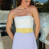 Fae Romper, Amanda Uprichard —a purple yellow strapless color-block mini
