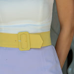 Fae Romper, Amanda Uprichard —a purple yellow strapless color-block mini