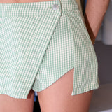 Green checkered shorts worn by a person going to a St.Patrick's day parade