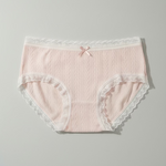 Pink lace-trimmed underwear on a gray background