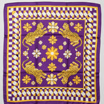 A square purple silk scarf with a gold and white checkered border, featuring four yellow leopards and white flowers in the center