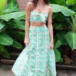 Woman wearing a Keisha Skirt Kehlani Top green floral matching separates.
