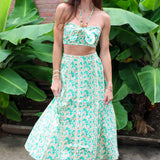 Woman wearing a Keisha Skirt Kehlani Top green floral matching separates.