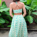Woman wearing a Keisha Skirt Kehlani Top green floral matching separates.