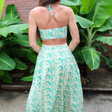 Woman wearing a Keisha Skirt Kehlani Top green floral matching separates.