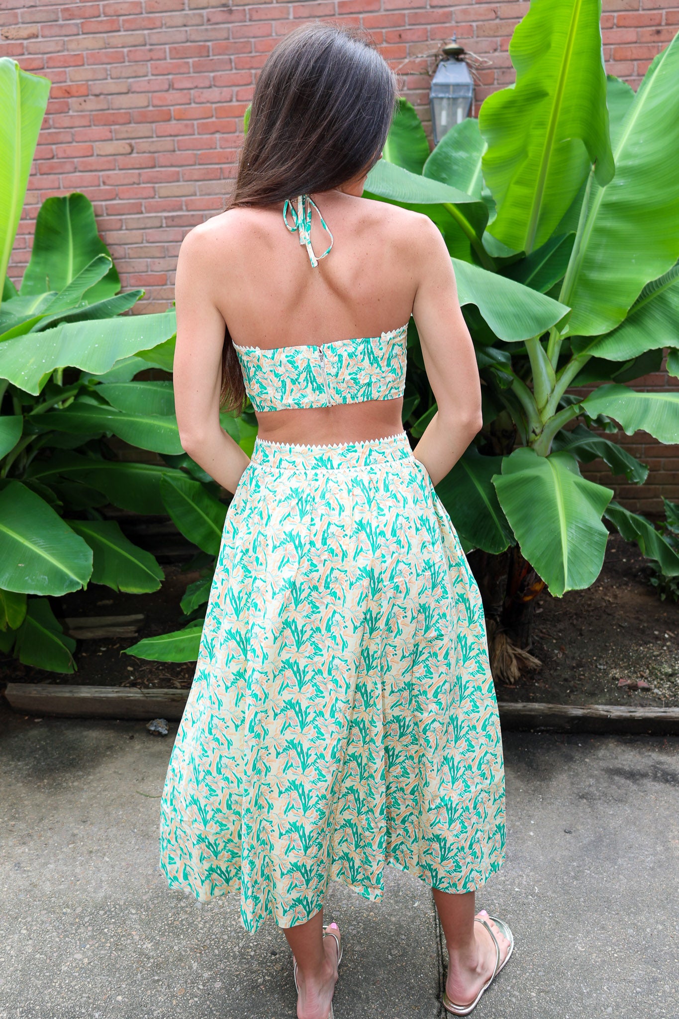 Woman wearing a Keisha Skirt Kehlani Top green floral matching separates.