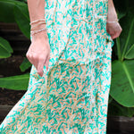 Woman wearing a Keisha Skirt Kehlani Top green floral matching separates.