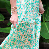 Woman wearing a Keisha Skirt Kehlani Top green floral matching separates.