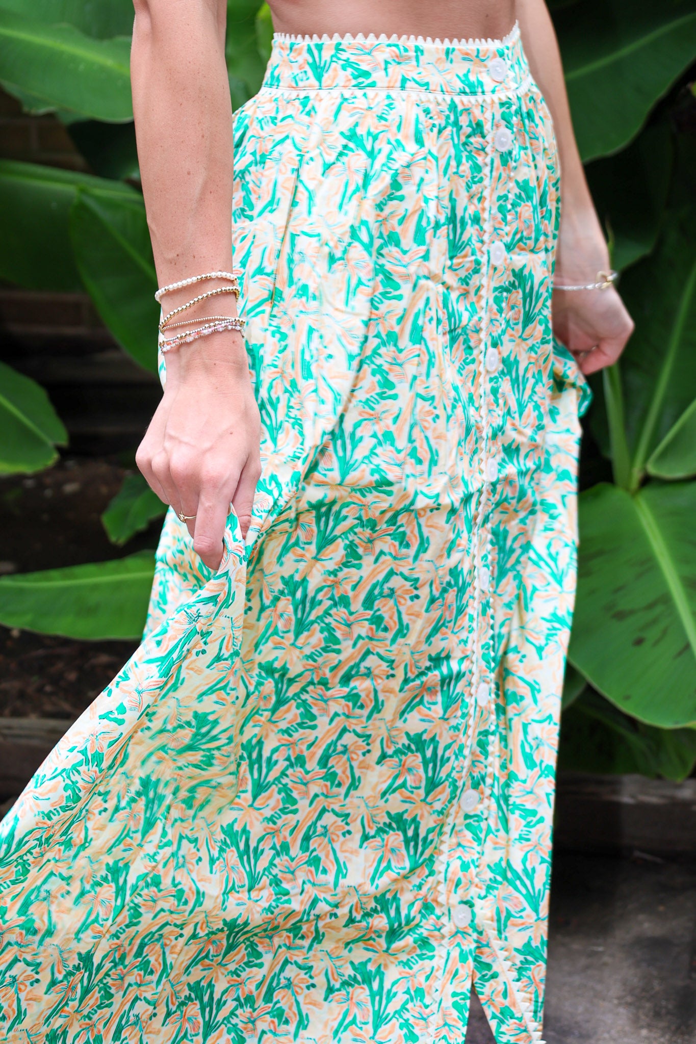 Woman wearing a Keisha Skirt Kehlani Top green floral matching separates.