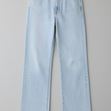 Light blue jeans on a gray background