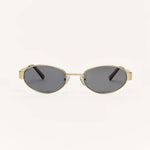 Z Supply Oval sunglasses with a gold-tone metal frame and dark gray lenses, shown from the front on a plain off-white background.