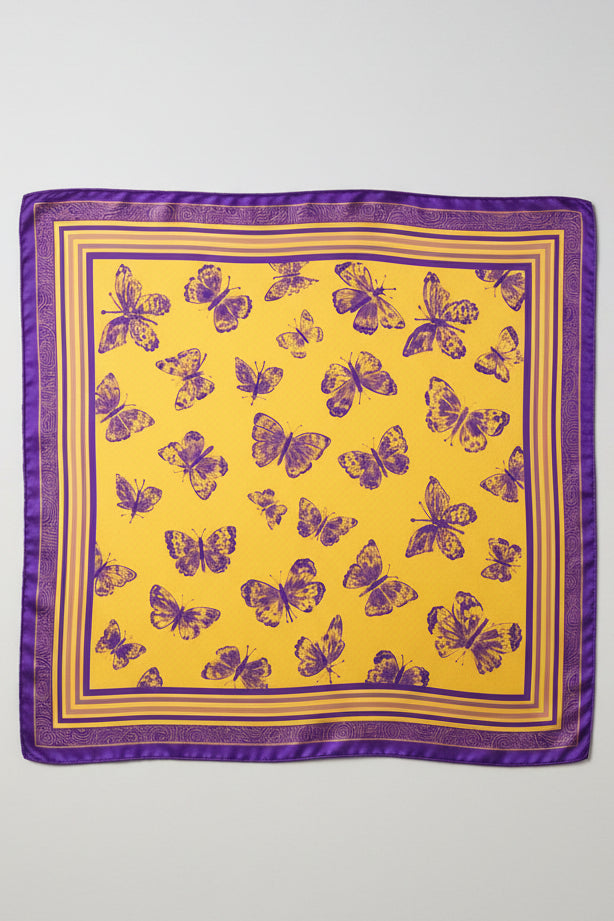 A square satin scarf with a vibrant yellow background, decorated with a pattern of purple butterflies and a matching purple border, shown flat against a white background.