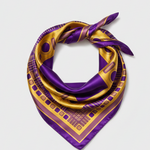 A square silk scarf with a purple and gold geometric border pattern, shown flat against a solid white background.