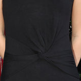 sleeveless black knit midi dress with a knot detail on a person
