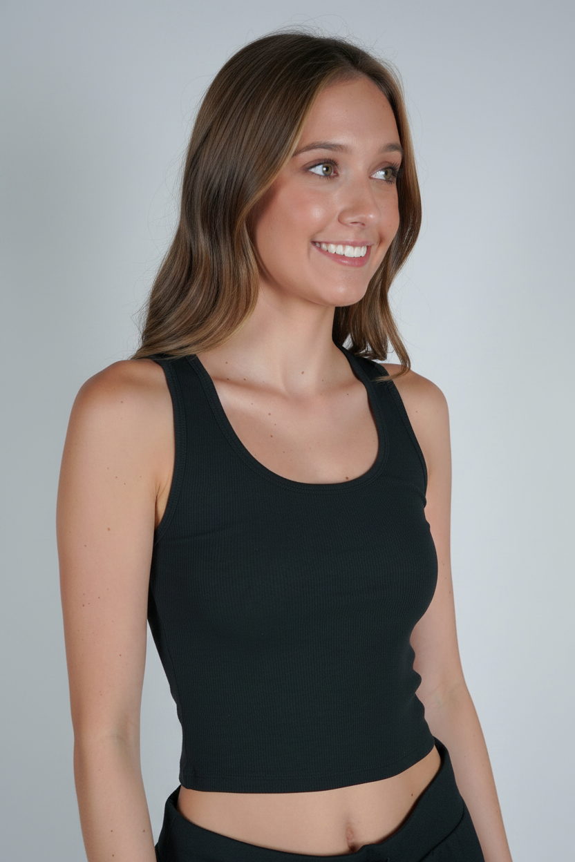A woman wearing a black ribbed tank top.