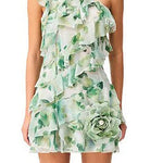 Woman wearing a Solene Mini dress by Elliatt that is green floral one-shoulder dress