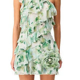 Woman wearing a Solene Mini dress by Elliatt that is green floral one-shoulder dress