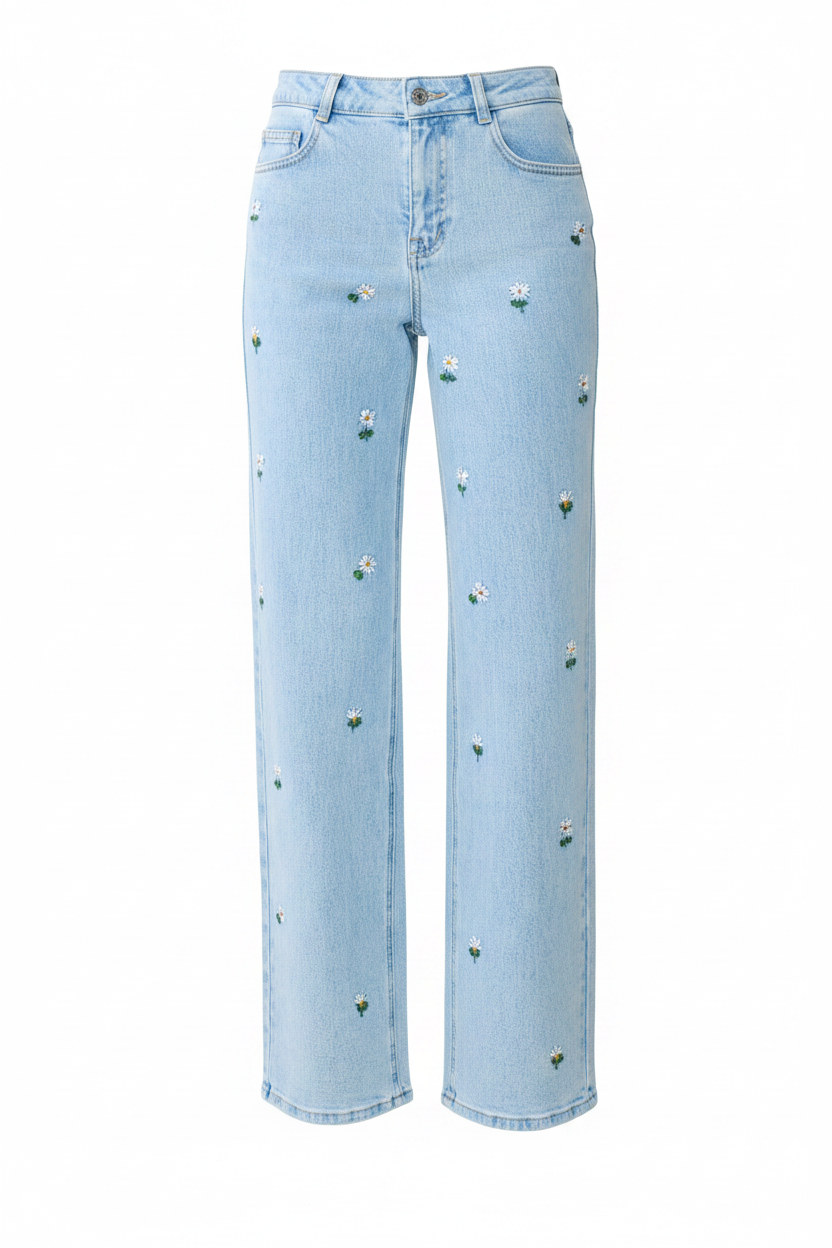 Light blue denim jeans with small embroidered white flowers and green stems scattered across the front, shown on a plain white background.