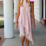 Sleeveless light pink mock-halter neck matching skirt set with a diagonal front cut and lace trim at Rodeo Boutique